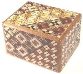 Small yosegi puzzle box covered in geometric wood mosaic